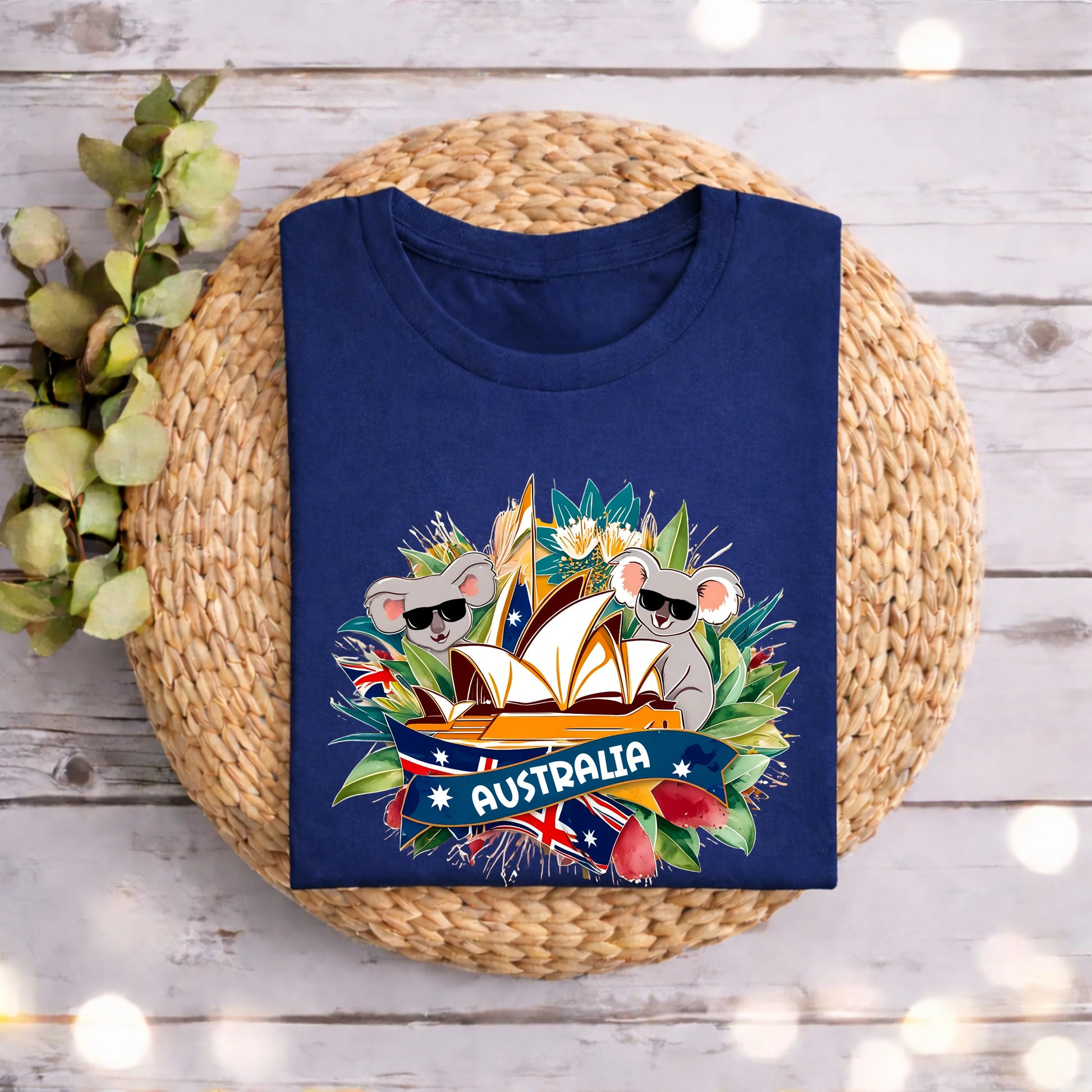 Navy blue t-shirt with Australia-themed design featuring koalas, the Sydney Opera House, and Australian flags for kids and adults