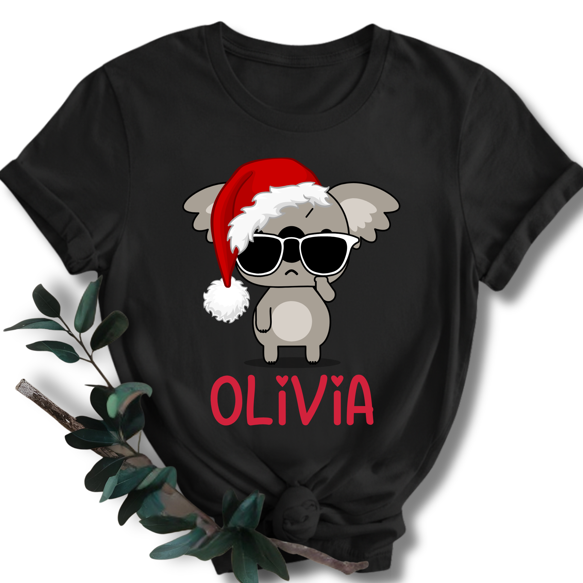 Black t-shirt with a cartoon koala wearing a Santa hat and sunglasses, and the name 'Olivia' on a white background.