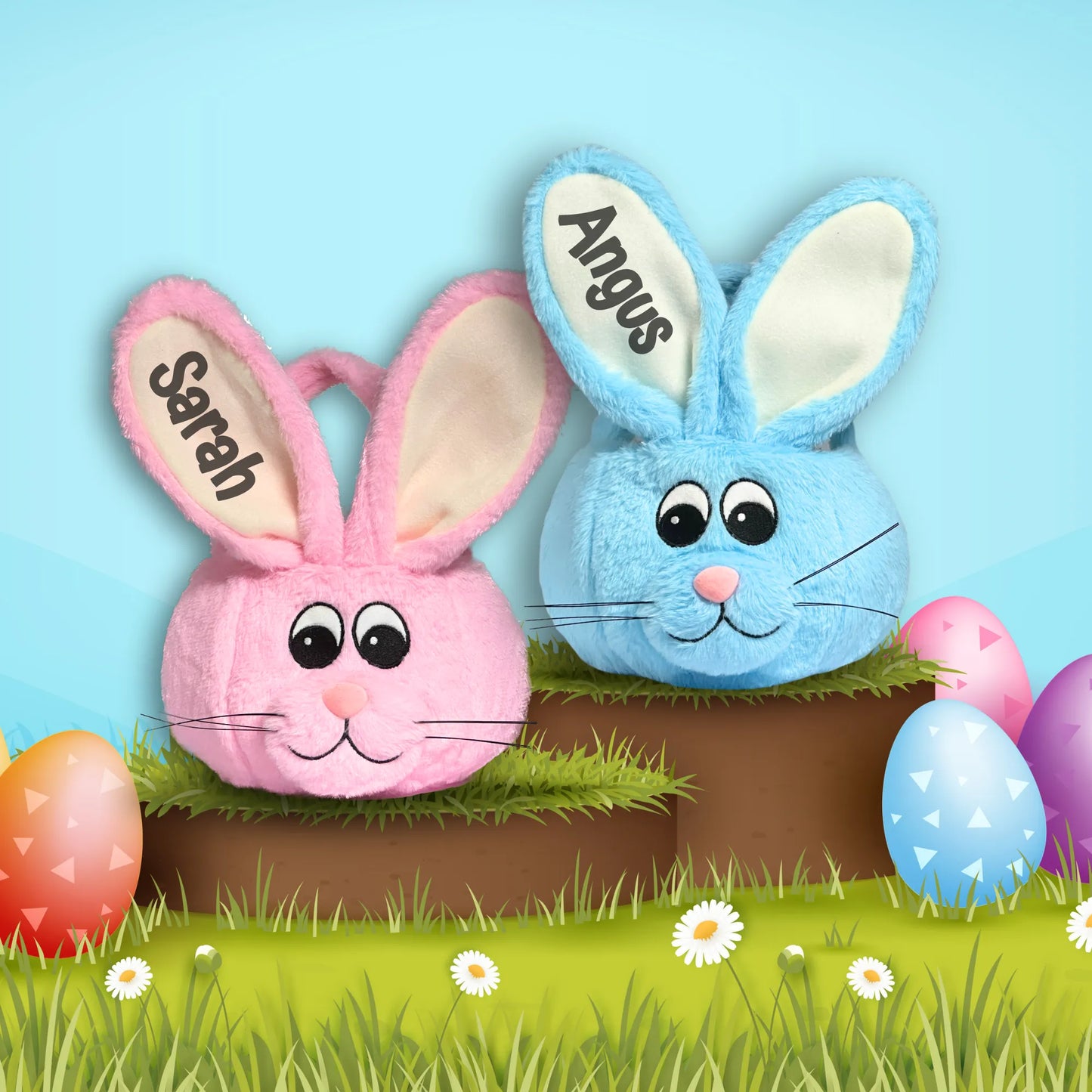 Two plush bunny toys, one pink and one blue, with 'Sarah' and 'Angus' names on their ears, surrounded by Easter eggs and grass.