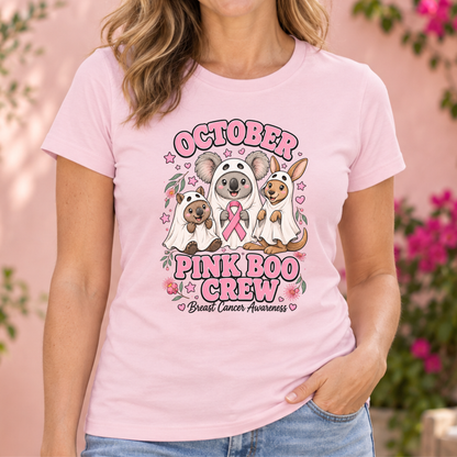 Woman wearing a powder pink October Pink Boo Crew breast cancer awareness Halloween shirt